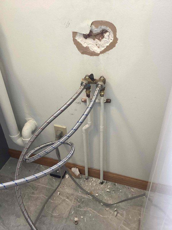 Responded to service call for leaking single-handle laundry valve. Identified water damage to surrounding drywall from the leak. Successfully replaced the defective valve and restored proper function to the washing machine water supply system.