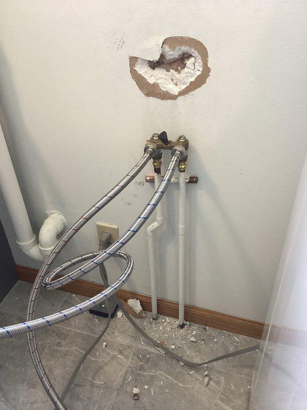 Responded to service call for leaking single-handle laundry valve. Identified water damage to surrounding drywall from the leak. Successfully replaced the defective valve and restored proper function to the washing machine water supply system.