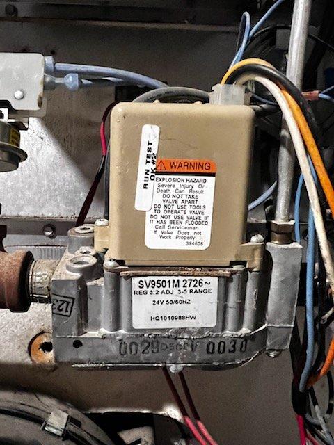 Responded to no heat complaint for a 1999 Heil furnace. Diagnostic inspection revealed multiple critical failures including a burned out igniter, cracked heat exchanger, and severely rusted exhaust pipe. Due to safety concerns and extensive deterioration, recommended immediate system replacement and provided temporary space heaters until replacement could be installed.