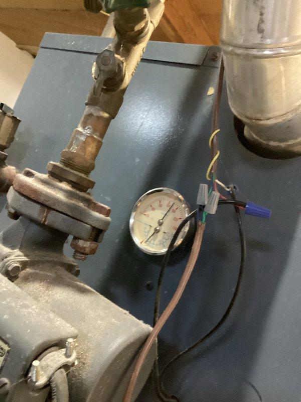 Diagnosed 1991 boiler unable to maintain desired temperature (67°F actual vs 70°F setpoint) during extreme cold weather. Increased water temperature settings to extend run time and improve heating capacity. Scheduled follow-up estimate for replacement with a more efficient system better suited to handle current heating demands.