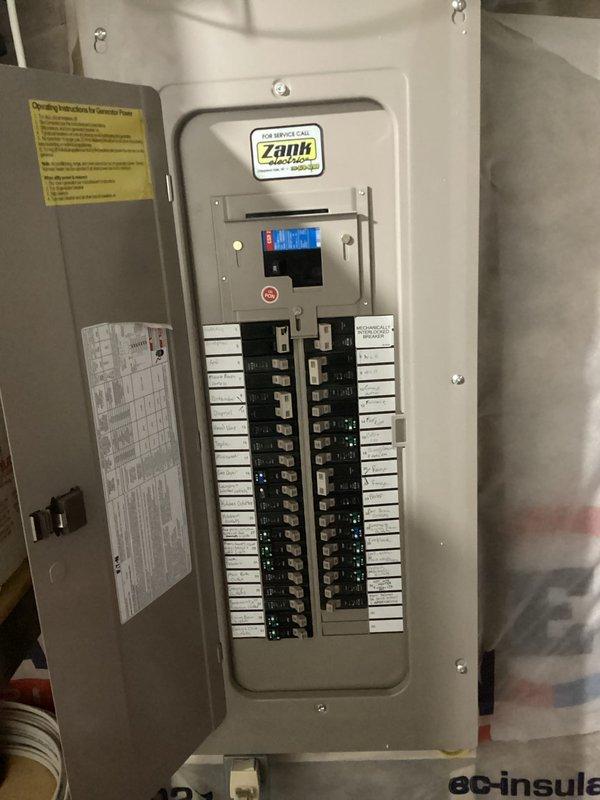 Responded to warranty call regarding lukewarm hot water. Determined water heater was sooted due to low gas pressure. Replaced water heater and coordinated with River Valley to replace regulator and verify proper gas pressures. Documented electrical panel and utility room configuration with photos.
