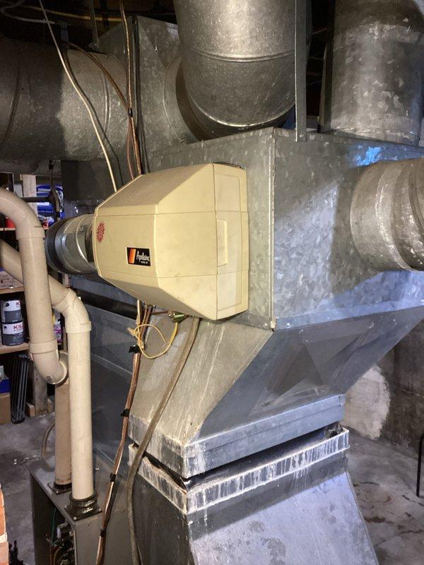 Responded to no-heat service call for an older oil furnace. Upon arrival, unit was operational with all components appearing to be in good working condition. Conducted thorough inspection of system including blower motor assembly and humidifier installation. Unable to replicate reported issue during visit; suspect possible intermittent transformer malfunction but deferred replacement pending observation of actual failure.