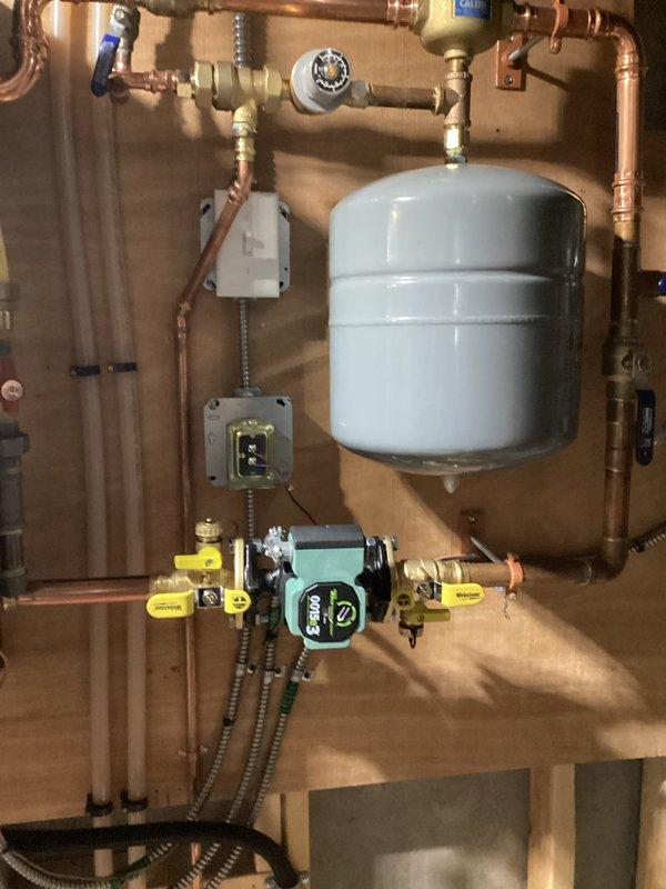 Diagnosed electrical issue with recently installed IBC boiler that was causing repeated circuit breaker trips. Found defective neutral connection with 120V present on L1 to ground but no voltage from hot to neutral. Restored proper electrical connections, verified system operation, and confirmed stable heating function for in-law suite.