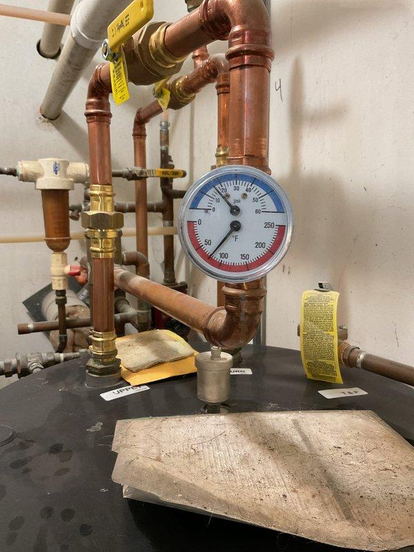 Diagnosed and repaired no-heat issue on 8-year-old boiler system where relay was chattering on pump control when jumped at thermostat connection but operated properly when jumped at control. Temporarily restored heating functionality by installing customer's thermostat directly in mechanical room to bypass faulty wiring.
