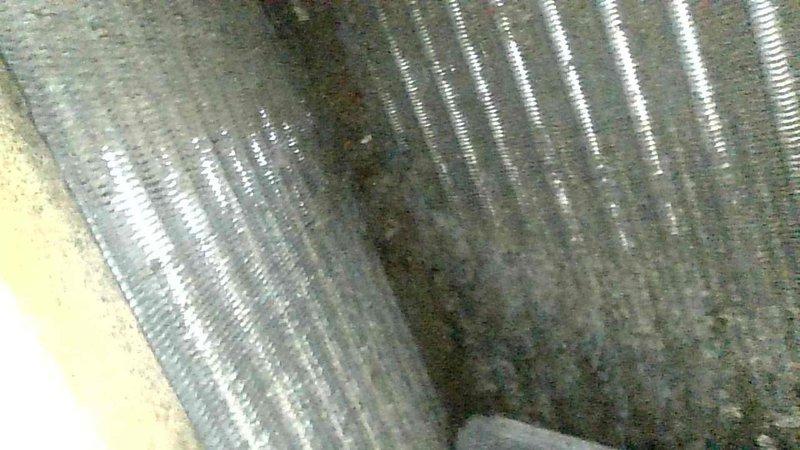 Responded to no heat complaint on 24-year-old Gibson furnace blowing cold air. Diagnosed condensate drainage issue; cleared blocked drain lines that previous technician had only partially addressed. Inspection revealed actively leaking heat exchanger collector boxes. Temporarily restored heat function after drain system service, but scheduled follow-up appointment due to critical heat exchanger deterioration requiring immediate attention.