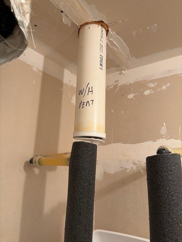 Responded to emergency water leak caused by a broken 3" water heater vent cap that allowed rainwater to infiltrate and flood the residence. Upon arrival, located the source of flooding and verified the main water supply had been shut off. Installed a new 3" Fernco cap on the water heater vent pipe (labeled "W/H VENT") to prevent further water intrusion. Explained to homeowner the service response protocols for after-hours emergency calls.