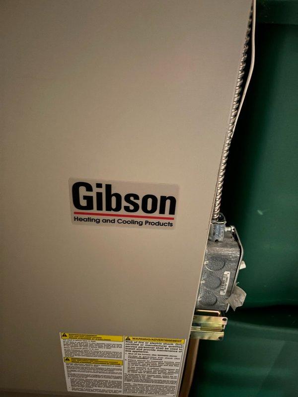 Responded to no heat call for 15-year-old Gibson furnace unable to maintain temperatures above 65°F. Diagnostic revealed slow blinking yellow indicator light and plugged condensate trap. Performed maintenance by cleaning flame sensor with Scotch-Brite pad and clearing blocked drain line, which restored proper operation. Monitored system until temperature reached 67°F, confirming successful repair.
