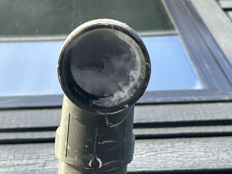 Responded to no heat call for 2-year-old Lennox furnace. Diagnosed intake frost blockage and improper exhaust termination as root causes. Cleared frozen intake and corrected exhaust pipe positioning, restoring proper operation and heat to the residence.