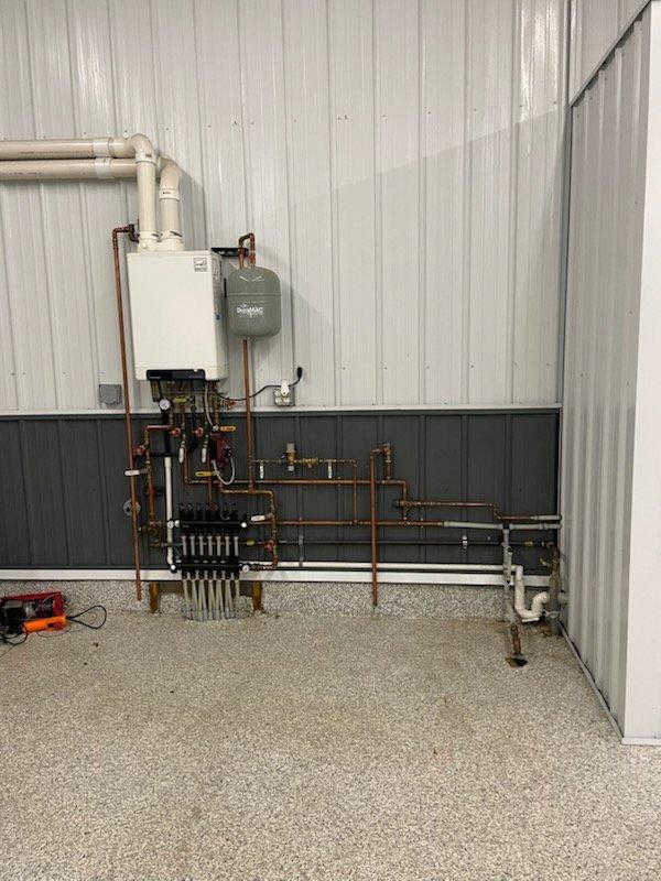 Responded to emergency call for burst pipes on a residential boiler system. Inspection revealed three burst sections on the domestic boiler side and one damaged pipe entering the heat exchanger. Documented extensive water damage to surrounding wall area. Recommended service advisor consultation for comprehensive repair plan and advised client that HVAC technician verification may be required once repairs are completed.