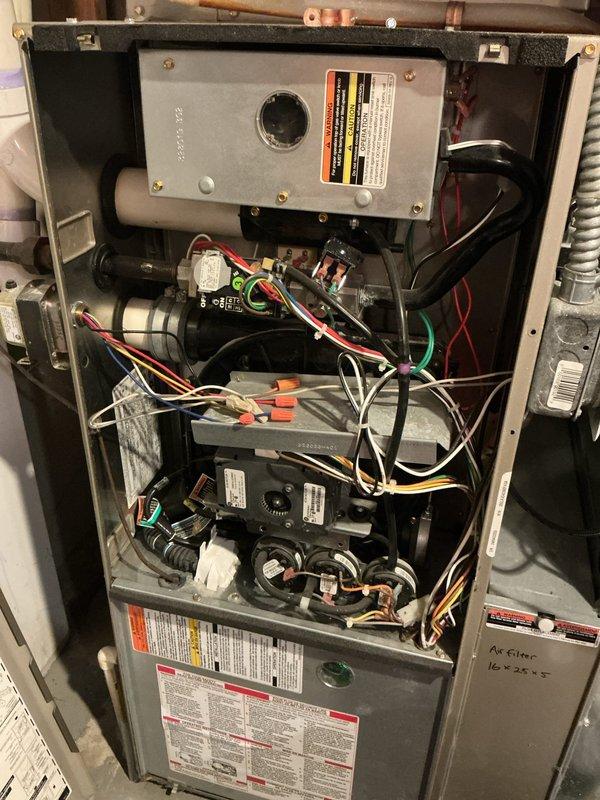 Performed diagnostic assessment on 16-year-old Bryant Plus 95s Evolution furnace experiencing no heat condition. Identified tripped flame rollout switch caused by failed secondary heat exchanger. Inspection revealed heat exchanger rusted through from inside out, leaking carbon monoxide. System deemed unsafe to operate due to critical safety hazard. Scheduled same-day estimate for replacement unit.