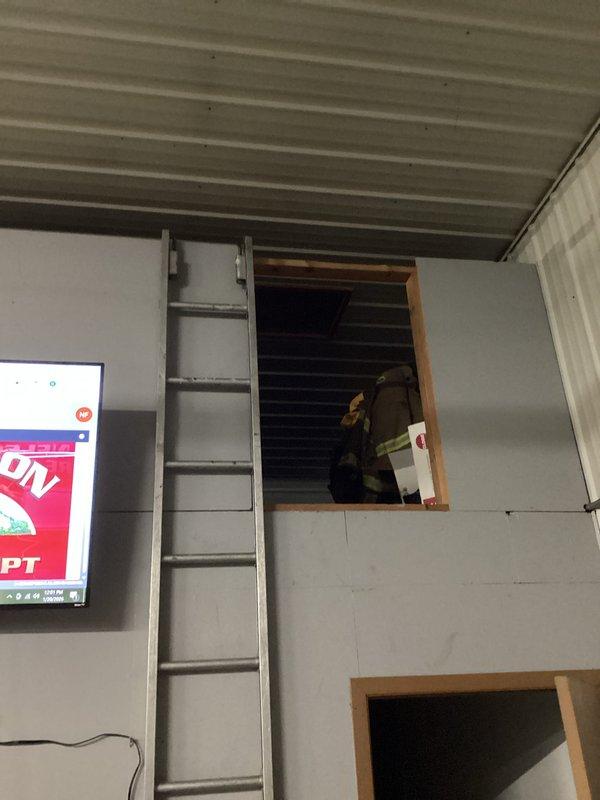 Responded to no heat call for commercial tube heater system. Upon arrival, found both units operational with temperature at 65°F. Customer had recently brought cold trucks in following a fire call, creating excessive heating load. Replaced thermostat as requested by customer and verified proper system operation. Recommended cleaning reflectors to improve radiant heat efficiency of the tube heater.