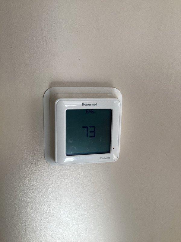 Replaced non-connecting Honeywell Pro Series thermostat with new unit after troubleshooting connection issues. Successfully established internet connectivity, allowing customer to control heating system via mobile device as requested. System now functioning properly with heat cycling as intended.