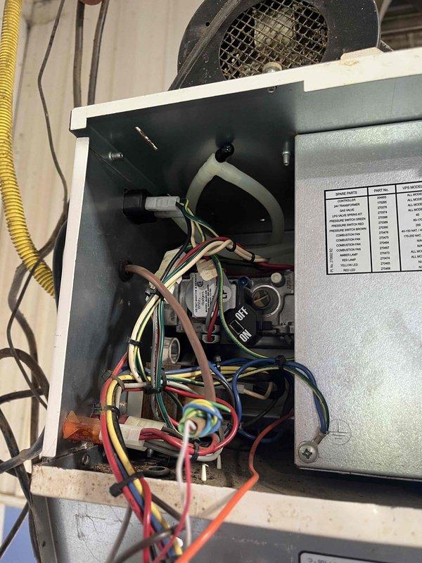 Diagnosed no heat issue on Reznor heater in milk house. Verified proper voltage at plug, transformer and to control board, confirmed safeties were functioning correctly. Determined control board was faulty as it showed no output voltage despite proper input. Replaced control board to restore heating functionality.