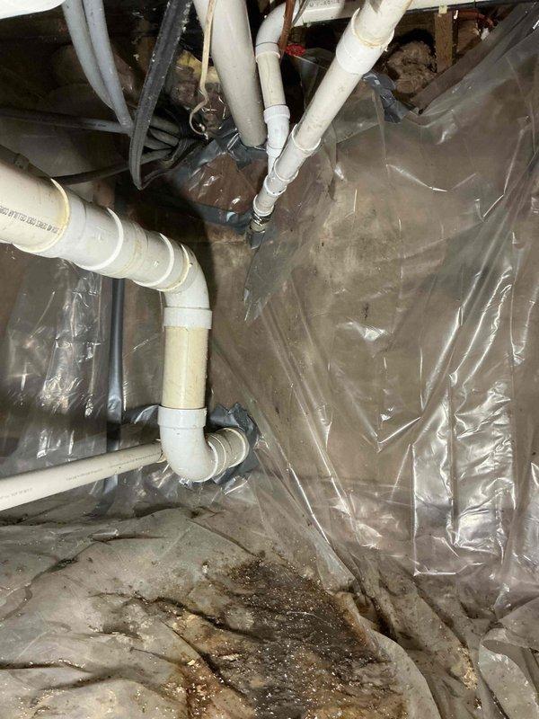 Responded to water leak service call for dual issues: leaking toilet shut-off valve in upstairs bathroom and leaking PVC pipe in basement. Tightened the packing nut on the angle stop to resolve the toilet valve leak. Replaced small section of damaged PVC piping in the basement to eliminate the second leak point.