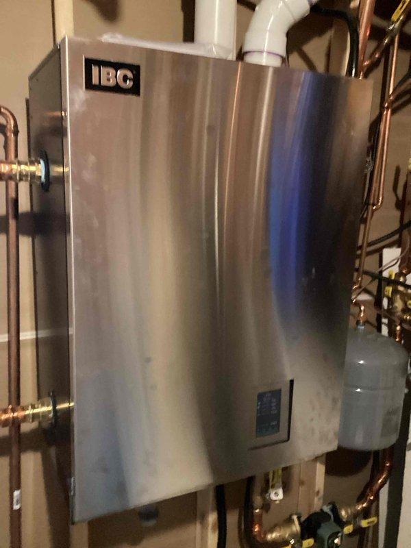 Diagnosed insufficient heating on main level of home with recently installed boiler system. Identified circulation issue with main level zone. Replaced existing pump with Grundfos model after determining original pump was causing noise through piping when operating at higher speeds. Verified proper operation of all zones and actuators after replacement. System now functioning normally with adequate heat distribution.