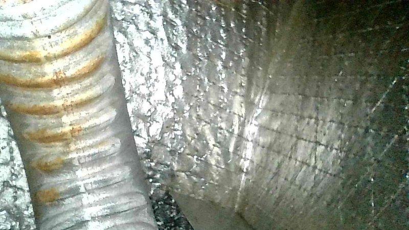 Diagnosed no heat issue in aging system, finding extensive rust damage in the inducer motor assembly and heat exchanger. Visual inspection revealed significant corrosion in the ductwork and deterioration of the heat exchanger fins. Recommended system replacement due to equipment age, extent of rust damage, and prohibitive repair costs compared to replacement value.
