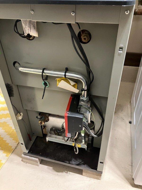 Responded to no heat call for 19-year-old furnace that was in lockout mode. Diagnosed issue by following manual troubleshooting steps, identifying extremely dirty flame sensor as the root cause. Cleaned sensor component thoroughly, purged air from system, and verified proper operation. System is now functioning correctly. Recommended equipment upgrade due to age, and scheduled comfort advisor consultation.