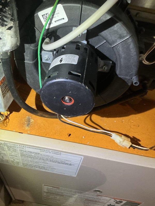 Diagnosed 24-year-old Lennox furnace with no heat complaint. Found seized exhaust fan motor (FASCO U21B) causing burning smell. Inspected heat exchanger with no failures detected, but noted significant system rust. Replaced draft motor to restore heating function. Recommended system replacement due to age and condition; comfort advisor scheduled for follow-up consultation.
