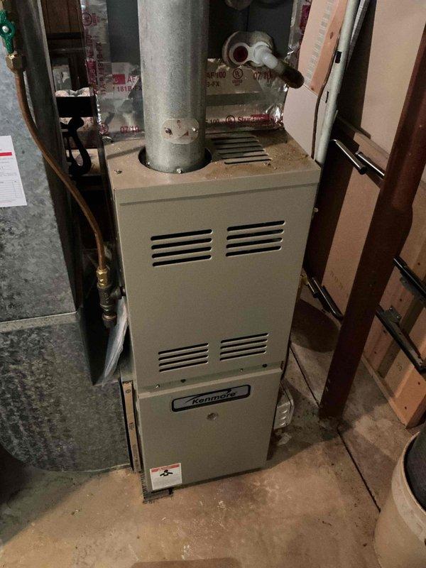 Responded to no-heat service call for a Kenmore furnace less than 10 years old. Diagnostic inspection revealed system was operational upon arrival but had failed previously. Internal examination showed significant dust accumulation on circuit board components and blower assembly. Cleaned critical electrical connections, performed system test cycle, and recommended replacement of aging motor components to prevent future failure.
