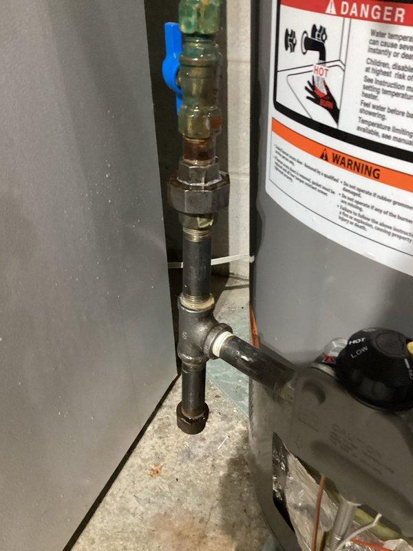 Responded to gas leak concern at water heater. Located leak at pipe fitting using electronic gas detector. Disassembled affected fittings, applied new sealant, and reassembled the connection. Post-repair testing confirmed successful elimination of gas leak, with no further leakage detected.