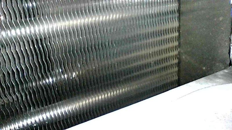 Responded to a no-heat service call for a 3-year-old furnace exhibiting prolonged heating cycles (one hour to increase one degree). Upon inspection of the system, found the existing 1-inch filter had been recently changed by homeowner. Visual examination of the evaporator coil showed normal condition without obstructions. Verified proper system operation after service, with normal heating performance restored.