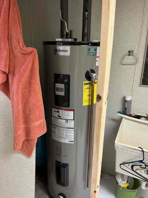 Responded to emergency call for a burst half-inch copper line in unfinished basement that required homeowner to shut off whole house water supply. Repaired split copper waterline and installed isolation valves for bathroom at far end of house, providing sectional water shut-off capability to prevent future whole-house water interruptions during repairs.