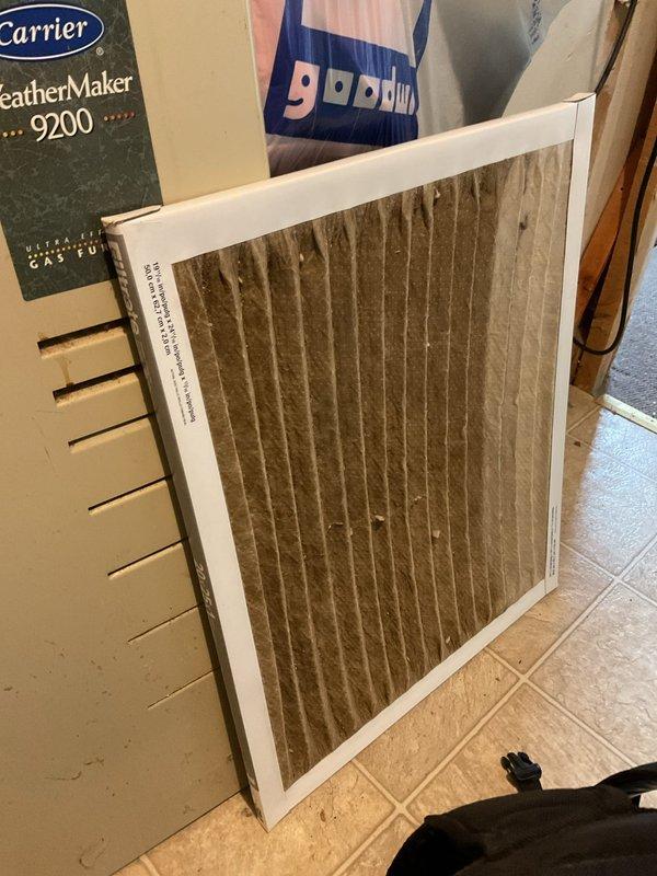 Responded to no-heat service call for 10+ year old Carrier furnace. Inspection revealed completely plugged filter causing restricted airflow, resulting in overheating and secondary heat exchanger failure. Observed severely compromised combustion with yellow flame pattern. System was only producing 10° temperature rise. Equipment was red-tagged due to safety concerns and emergency service was scheduled for replacement.