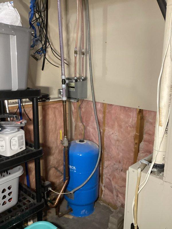 Responded to service call for 80-gallon AO Smith electric water heater installed in 2022 that was leaking from the bottom. Diagnosed tank failure with no water at connection points. Replaced water heater under manufacturer warranty.