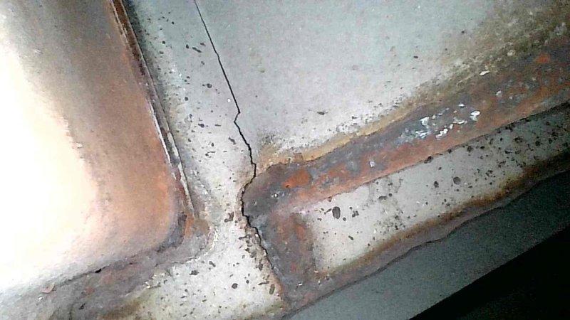 Performed inspection on 55-year-old oil furnace. Examination of heat exchanger revealed multiple cracks (at least seven identified), necessitating condemnation of the unit. Furnace was tagged out of service. Customer has alternative wood heating system and declined pricing options for replacement at this time.