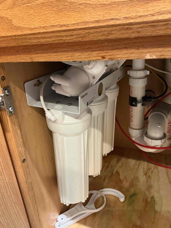Replaced multiple filters in customer's existing reverse osmosis (RO) water filtration system mounted under the kitchen sink. The multi-stage filtration unit was serviced according to manufacturer specifications, ensuring proper water treatment functionality and extending system lifespan.