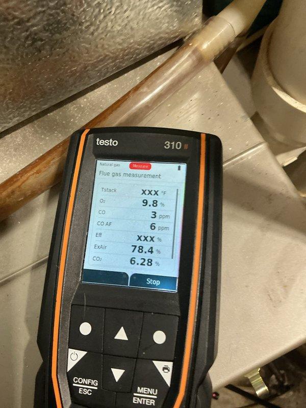 Performed standard maintenance tune-up on 21-year-old Bryant furnace. Identified plugged filter likely causing system to trip on high limit, explaining customer's reported intermittent system failures. Conducted combustion analysis with Testo 310 showing acceptable readings (O2: 9.8%, CO: 3ppm, CO2: 6.28%). Noted noisy draft motor requiring replacement; all other components functioning adequately. Heat exchanger inspection revealed no issues.