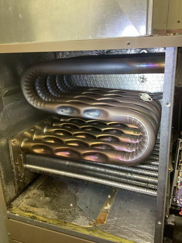 Performed comprehensive furnace tune-up including cleaning flame sensor, verifying clear condensate drainage, and inspecting heat exchanger components. Confirmed clean air filter and tested all electrical components, which were operating within specifications. Noted slight wobble in blower wheel operation suggesting possible imbalance, but access limitations prevented further inspection. System is functioning properly with appropriate 60° temperature rise.