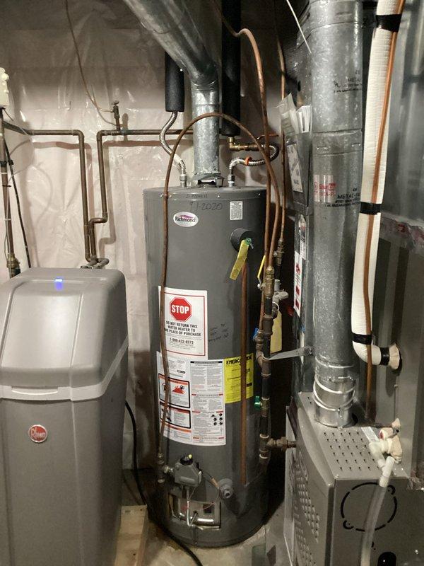 Responded to service call for Richmond water heater leaking. Upon inspection, identified an inner tank leak in the approximately 40-gallon gas water heater with standard venting. Diagnosed as non-repairable tank failure and presented replacement options to customer.