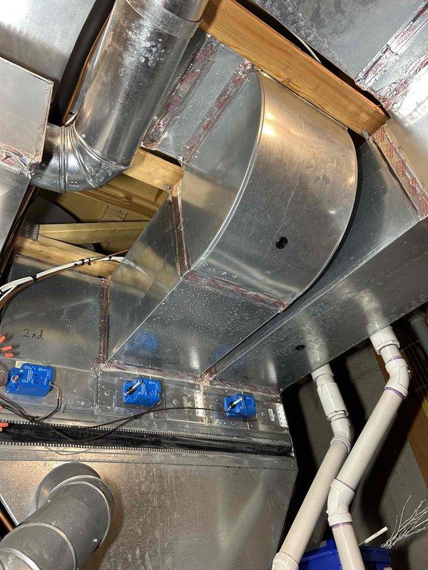 Performed routine furnace tune-up on Bryant system. Conducted comprehensive inspection including heat exchanger evaluation, combustion analysis, gas pressure verification (HI/LO stage), flame sensor and burner examination, and blower motor assessment. System operating normally with no immediate concerns identified. Cleaned pressure switch and confirmed proper thermostat operation. Air filter in moderate condition. Documented system components with photos of main humidifier unit, ductwork, and associated electrical connections.