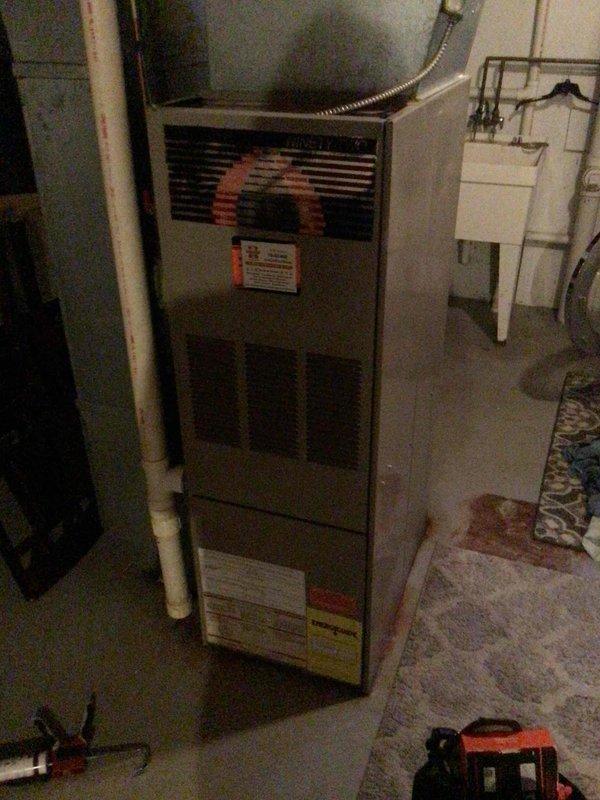 Responded to no heat complaint on aging furnace system that was repeatedly cycling on and off. Diagnostic inspection revealed the exterior exhaust pipe elbow was improperly installed without adhesive, allowing condensation to freeze and block proper ventilation. Applied silicone sealant to create proper seal on the exhaust pipe elbow and advised tenant about possible need to remove ice accumulation during extreme cold temperatures.