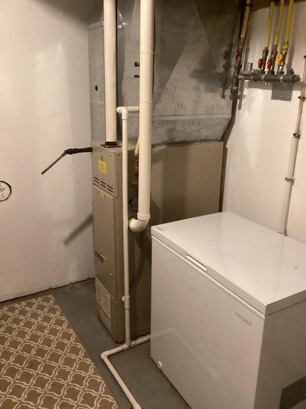 Responded to no heat call for 18-year-old furnace. Diagnosed intake vent obstruction due to frost and snow accumulation. Customer had already cleared blockage prior to arrival, which restored proper operation. Performed visual inspection confirming furnace functionality. Advised customer about keeping intake vent clear, particularly due to vulnerable location under deck, and recommended scheduling annual maintenance.