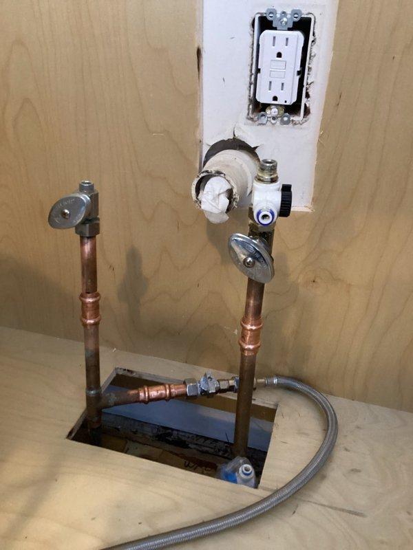 Shortened kitchen water supply lines and reinstalled shutoff valves to accommodate new cabinet installation. Replaced leaking dishwasher valve and properly connected all components to ensure proper function and prevent leaks.