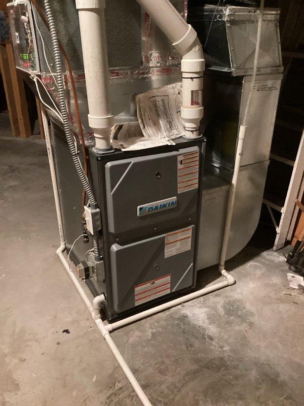 Responded to no-heat complaint where customer reported temperature dropping from set point of 70°F to 65°F. Inspection revealed furnace was operational but with restricted airflow due to dirty filter. Replaced filter and advised customer that during extreme cold weather, maintaining a 3-degree temperature differential is normal performance and recommended not setting thermostat above 70°F under these conditions.