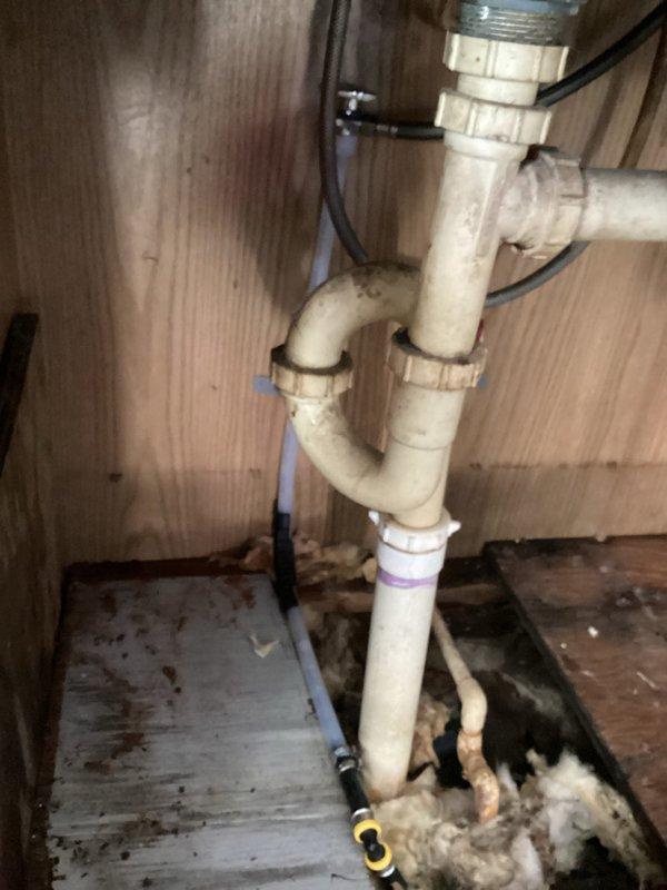 Responded to emergency service call for elderly customer with frozen and cracked CPVC pipe near kitchen sink causing water flow that could not be shut off. Successfully repaired the damaged pipe section and installed new PVC P-trap assembly with proper connections to restore normal plumbing function.