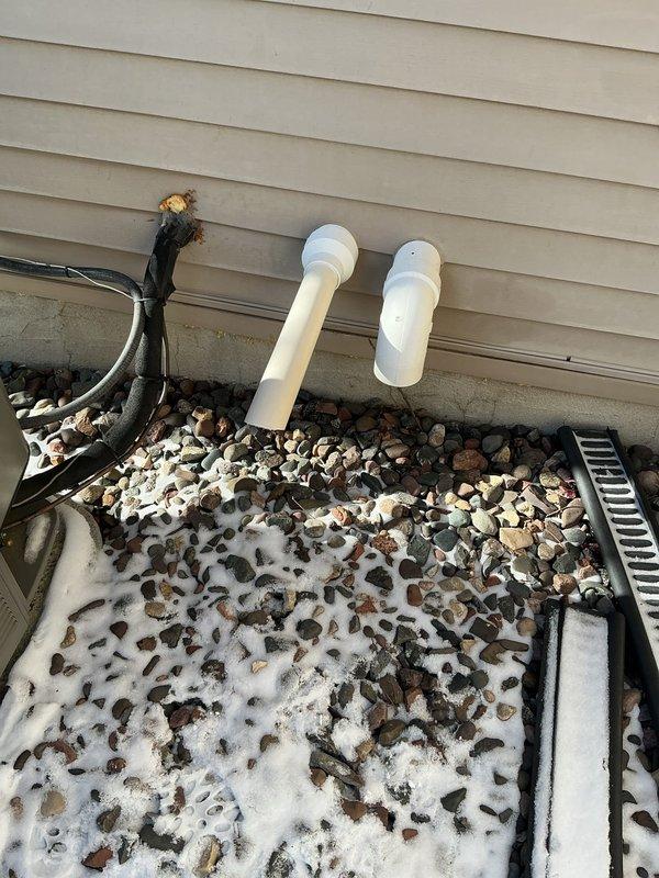 Responded to no heat complaint on a 2-year-old furnace system that was tripping on pressure switch. Diagnosed issue as frozen condensate drain trap caused by cold air intake positioned adjacent to the trap. Temporarily replaced inducer motor for diagnostic purposes, which confirmed the source of high-pitch noise was not the inducer itself. Cleared and cleaned the frozen drain trap, which resolved the operational issues and restored proper system function.