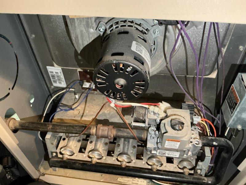 Responded to no heat call for 22-year-old furnace exhibiting short cycling. Diagnostic testing revealed failed flame sensor and severely compromised heat exchanger with multiple cracks and rust-through holes causing carbon monoxide leakage. Additionally, blower motor showed significant oil leakage. Due to critical safety concerns and age of unit, determined system unsafe for operation and scheduled replacement estimate.