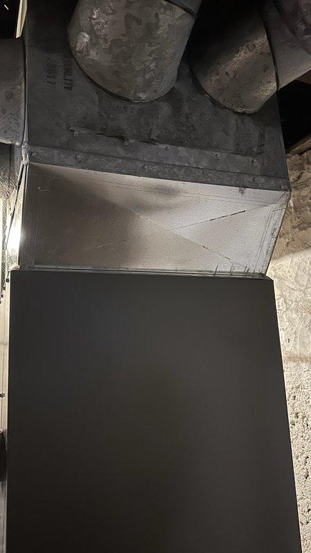 Responded to no heat complaint on 2-year-old furnace where homeowner expressed concern about basement temperatures potentially freezing pipes. Upon inspection, determined basement temperature was 59°F, well above freezing threshold. After evaluating ductwork configuration and discussing options with customer, drilled a 1-inch hole in supply run to provide moderate warm airflow to basement without compromising overall system performance or creating excess duct noise.