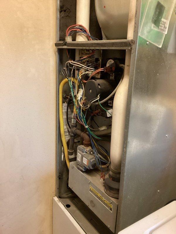 Diagnosed no-heat condition caused by a faulty main limit switch that was stuck in the open position. Performed temporary repair by relocating functional limit switch from blower motor assembly to main position and installing an alternative limit switch at the blower location. System restored to operational status, but recommended follow-up service to install proper OEM limit switch for permanent resolution.