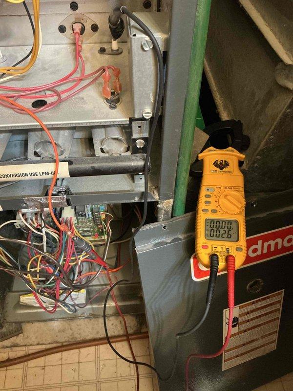 Diagnosed Goodman furnace (50+ years old) with no heat condition. Found unit short cycling and locking out due to overheating. All components tested operational, but identified high limit switch activation caused by restricted airflow. Recommended continuous fan operation at thermostat and replacement of thick filter with maximum MERV 7 rating. Observed temperature stress points on heat exchanger and intermittent shutdown possibly related to gas valve closure or voltage fluctuations. Scheduled follow-up for complete furnace replacement due to age and condition.