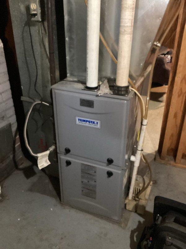 Responded to service call for unresponsive thermostat. Diagnosed blank display despite battery replacement, with heat still functioning but customer unable to make adjustments. Installed new Honeywell T4 thermostat, properly configured dip switches for first and second stage furnace control, and verified complete system operation of the Tempstar unit.