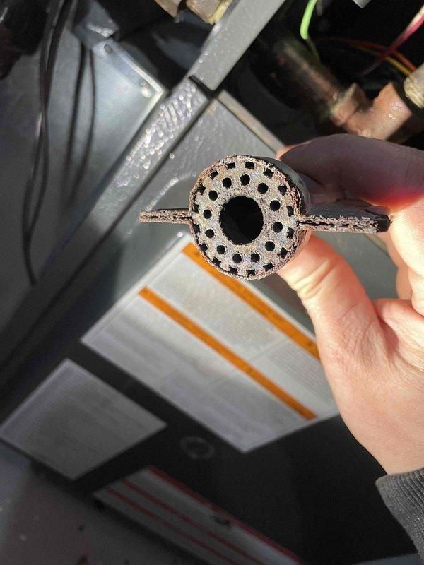 Responded to no-heat service call for furnace with intermittent ignition failure displaying "LO" error code. Diagnosed faulty gas valve failing to open despite receiving proper power signal. Temporarily restored operation through manual intervention, but observed severely rusted burners contributing to flame dropout issues. Performed visual heat exchanger inspection with no visible compromises detected. Recommended replacement of gas valve and burners along with complete system tune-up as permanent solution. Customer informed about high probability of recurring failure and discussed equipment replacement options.