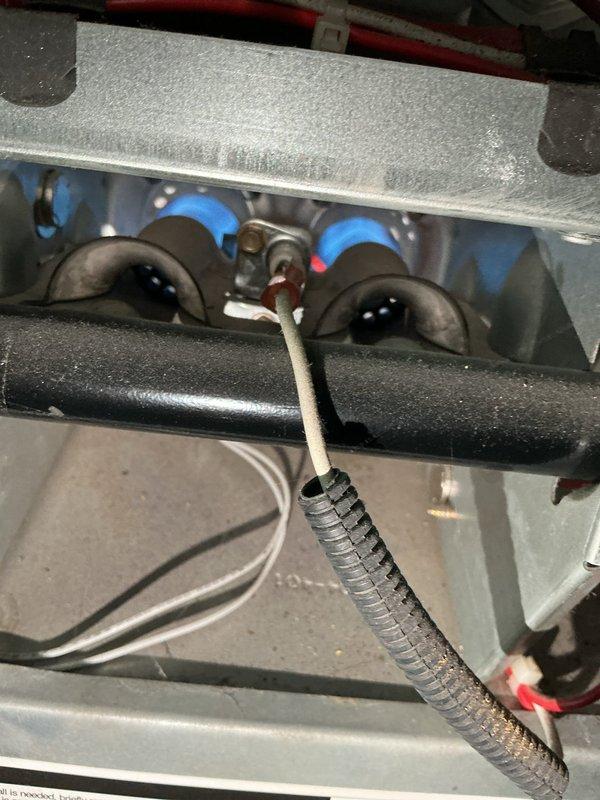 Diagnosed 16-year-old furnace with insufficient heating due to multiple critical issues including cracked heat exchanger, failing flame sensor, burn marks on control board, oil-leaking blower motor, and improper Merv 11 filter installation. Found evidence of previously bypassed high limit safety switch, creating dangerous operating conditions. Advised customer that repairs cannot be performed with bypassed safety features and recommended system replacement due to compromised heat exchanger integrity.