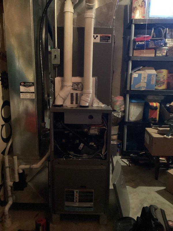 Responded to a no-heat call for a recently installed furnace that was running but blowing cold air with a flashing red light. Discovered the rollout switch had tripped; reset the switch which restored proper operation. Inspected heat exchanger thoroughly and found it in good condition. Determined the issue was likely a one-time occurrence as the system is now functioning normally with no further intervention required.