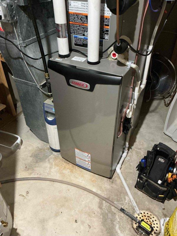 Responded to no-heat complaint on a new Lennox furnace with intermittent operation requiring hard resets. Diagnostic review revealed multiple pressure switch error codes. Identified exhaust termination with fine mesh screen causing condensation freezing during cold weather, restricting proper venting. Verified proper condensate drainage, performed multiple system cycles to confirm reliable operation, and noted improved draft motor temperature.