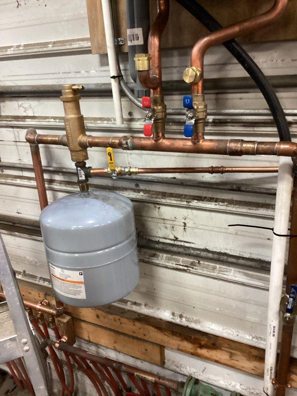Responded to no-heat call for 3-year-old boiler system. Diagnostic testing revealed zero pressure on boiler due to malfunctioning backflow preventer. Replaced backflow preventer and auto fill valve with ball valve to restore proper system operation and heat production.